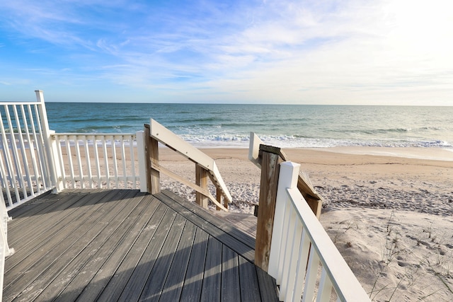 view of community with a view of the beach and a water view