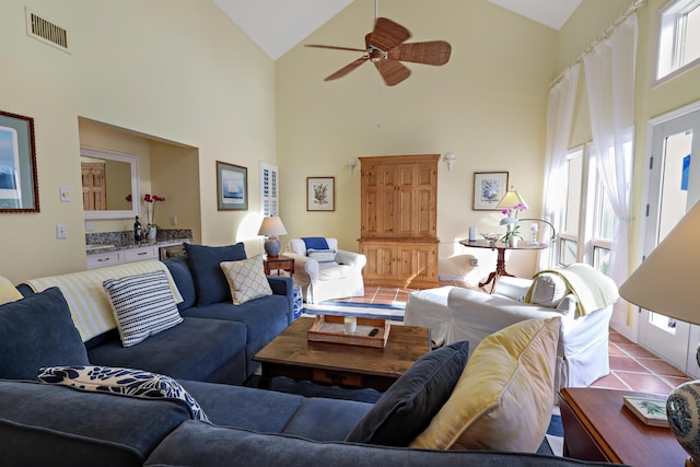 living room featuring high vaulted ceiling and a wealth of natural light