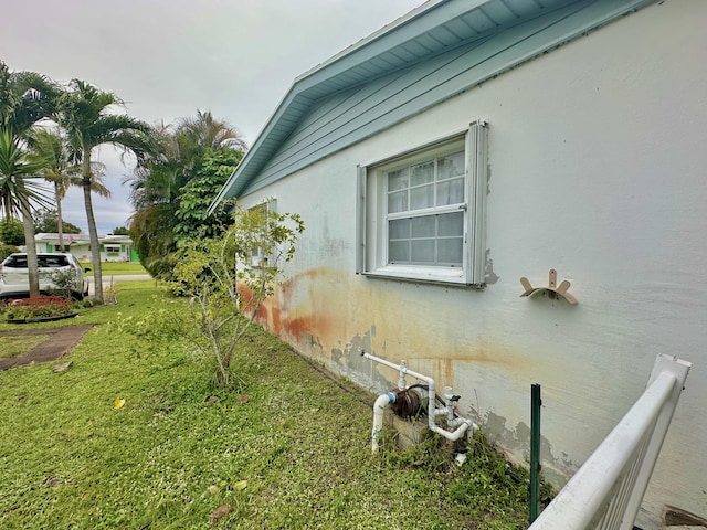 view of property exterior featuring a yard