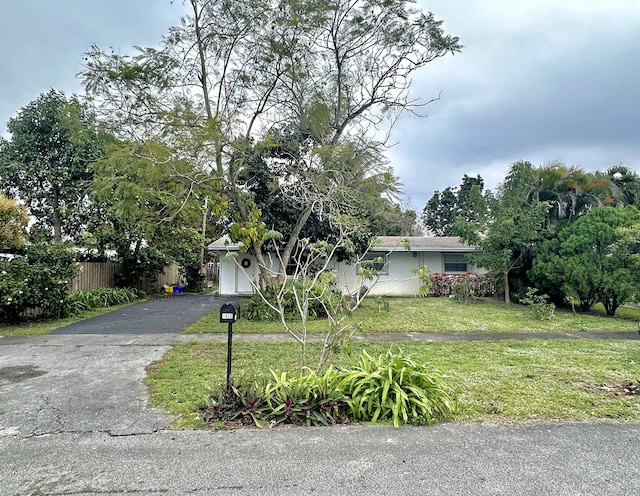 view of front facade with a garage and a front lawn