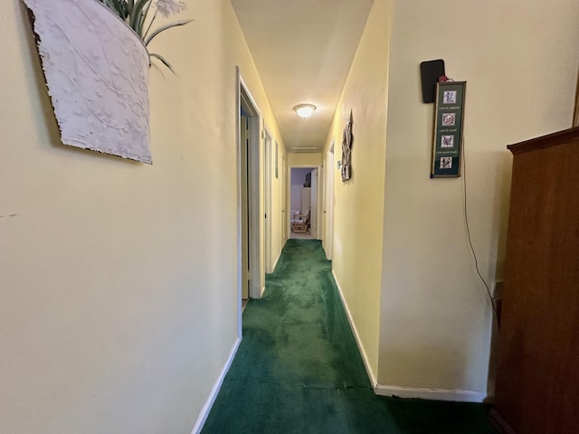 corridor with dark colored carpet