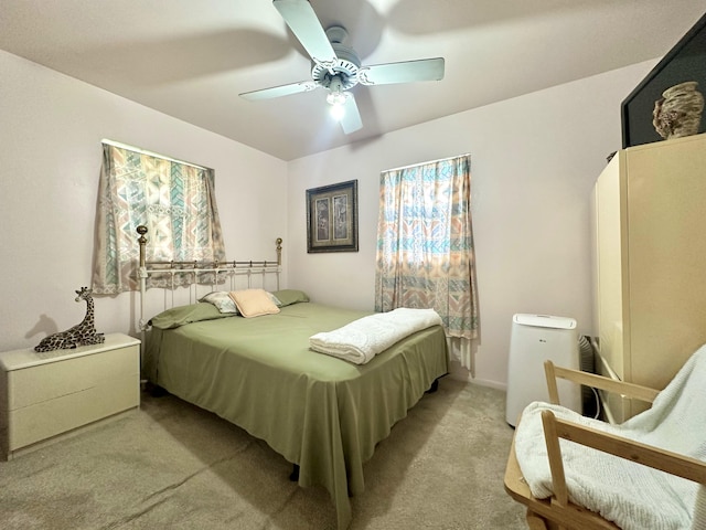 bedroom with light colored carpet and ceiling fan