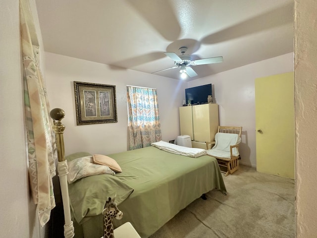 bedroom featuring light colored carpet and ceiling fan