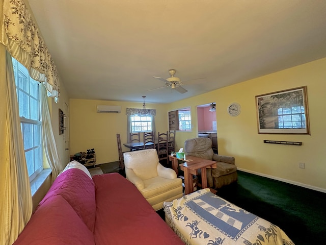 living room featuring a wall unit AC and ceiling fan