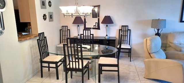 tiled dining space featuring a chandelier