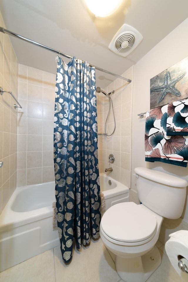 bathroom with shower / bath combo, tile patterned floors, and toilet