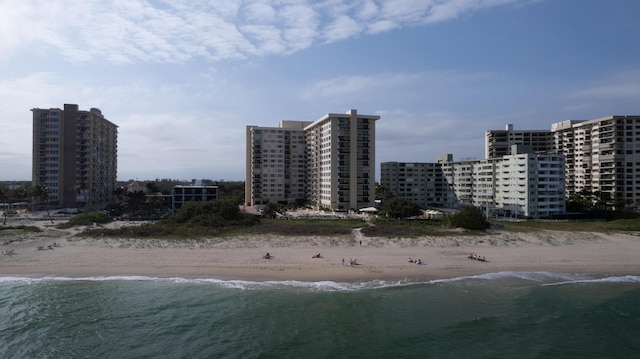 aerial view featuring a view of the beach and a water view