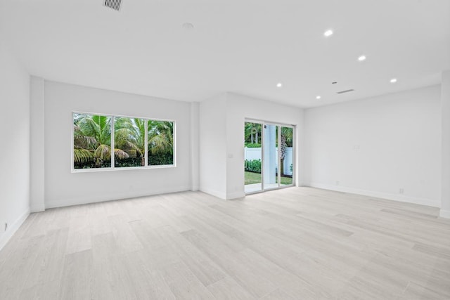 unfurnished room featuring light hardwood / wood-style floors