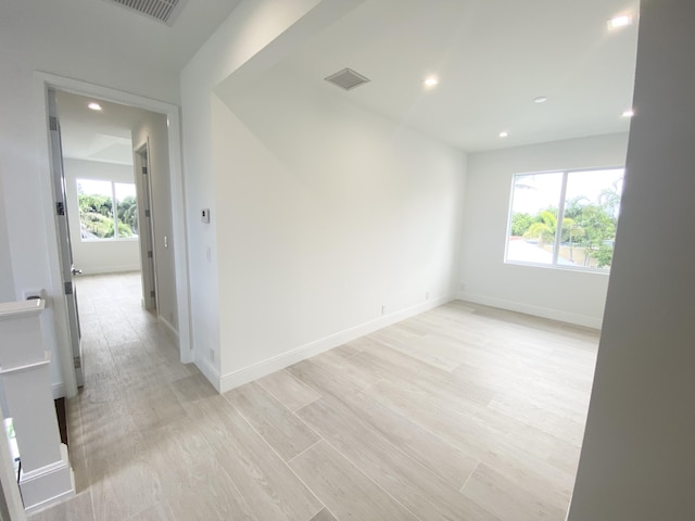 spare room with light hardwood / wood-style flooring