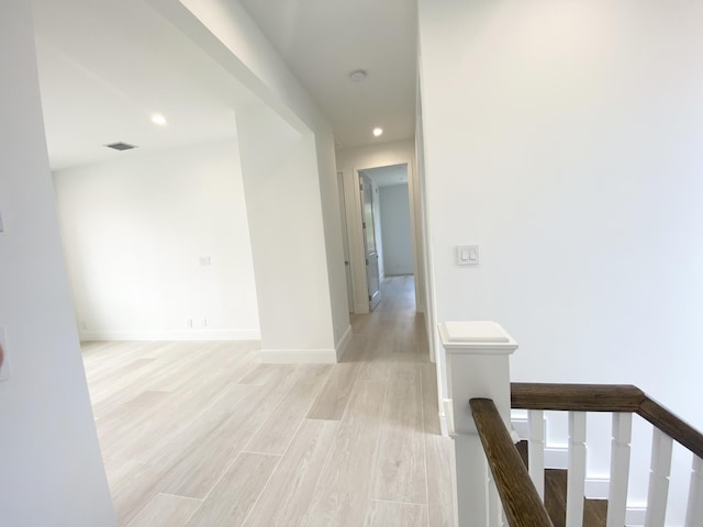 hallway featuring light hardwood / wood-style flooring