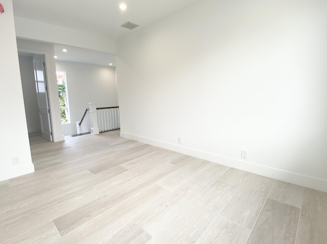 spare room featuring light hardwood / wood-style flooring