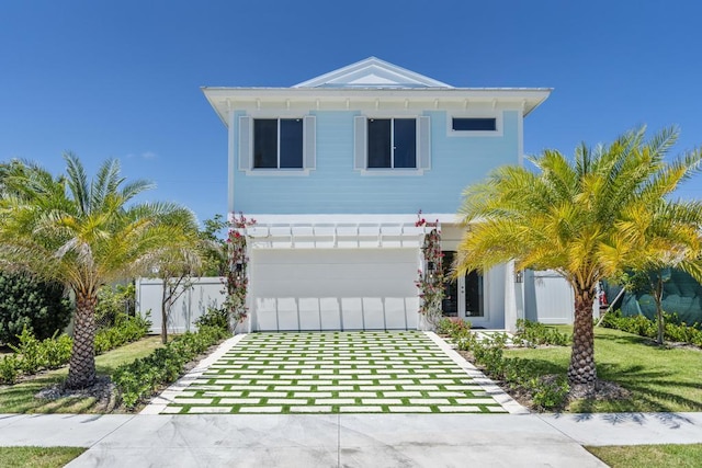 view of front facade with a garage and a front lawn