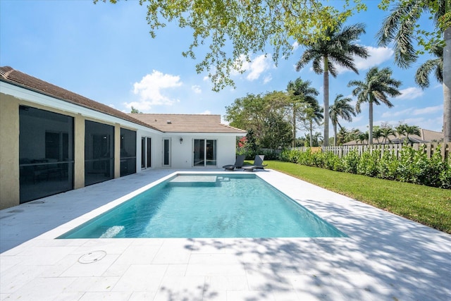 view of pool featuring a patio area and a lawn