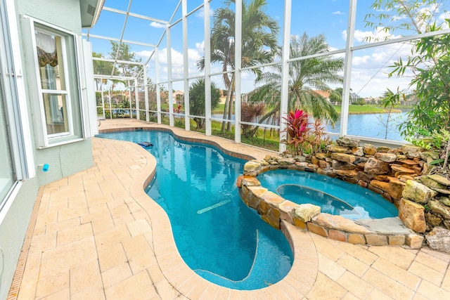 view of swimming pool featuring glass enclosure, a patio, and a water view