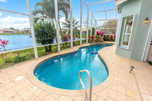 view of pool with a lanai, a patio, and a water view