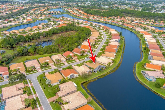 aerial view featuring a residential view and a water view