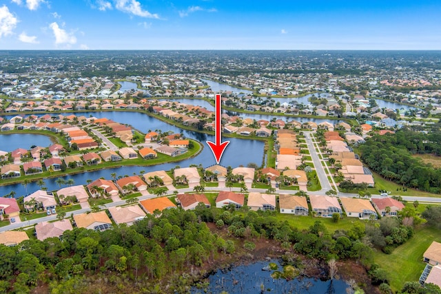 birds eye view of property featuring a residential view and a water view