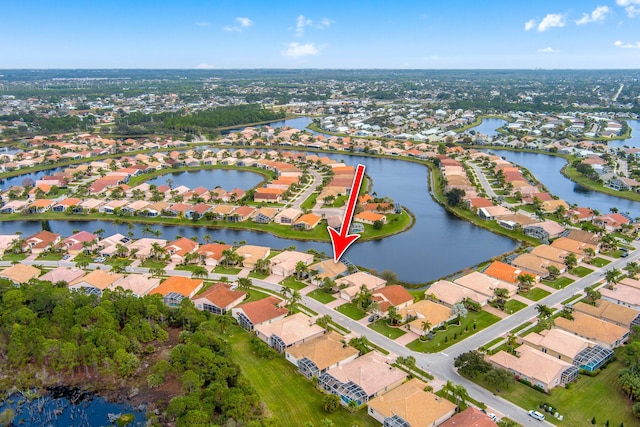 aerial view featuring a residential view and a water view