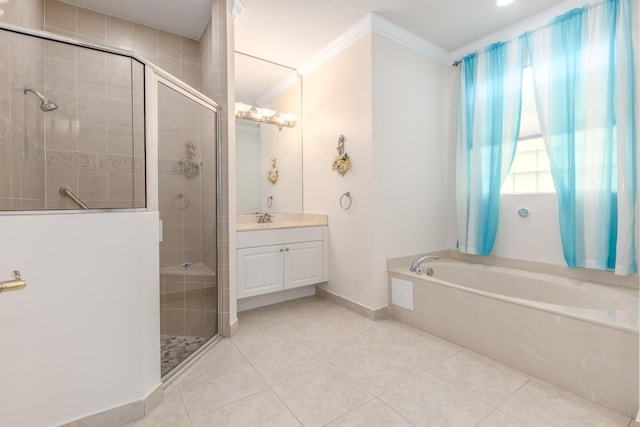 full bathroom featuring vanity, a shower stall, crown molding, a garden tub, and tile patterned floors