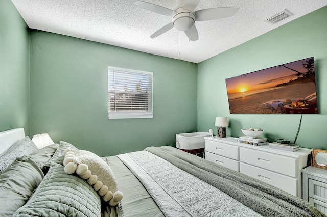 bedroom featuring a textured ceiling and ceiling fan