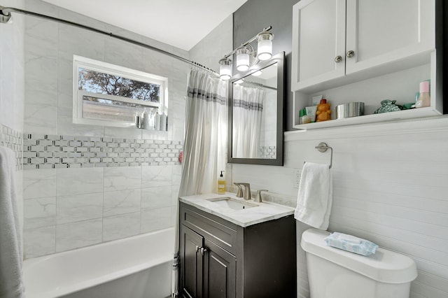 full bathroom with vanity, shower / bathtub combination with curtain, and toilet