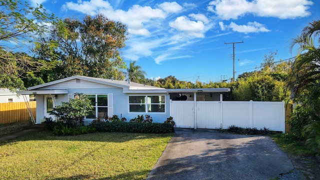 single story home with a front yard