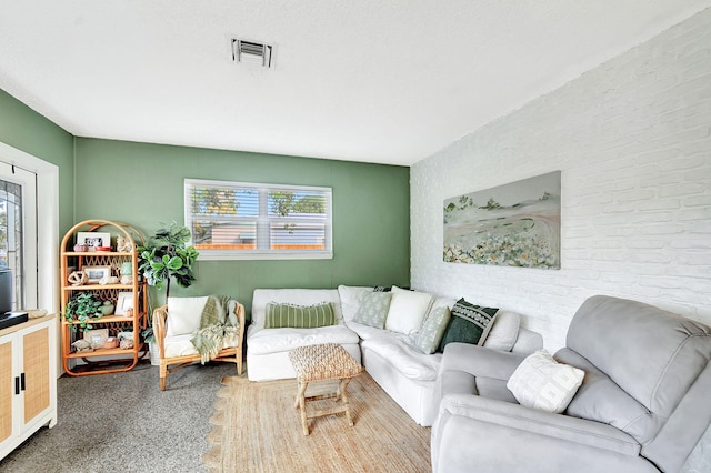 living room with brick wall