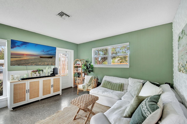 living room with a textured ceiling