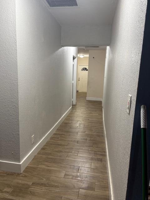 corridor featuring hardwood / wood-style flooring