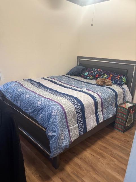 bedroom featuring hardwood / wood-style flooring