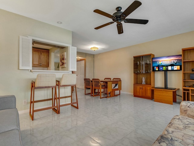 living room with ceiling fan