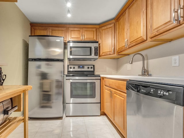 kitchen with appliances with stainless steel finishes and sink