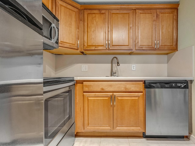 kitchen with sink and stainless steel appliances