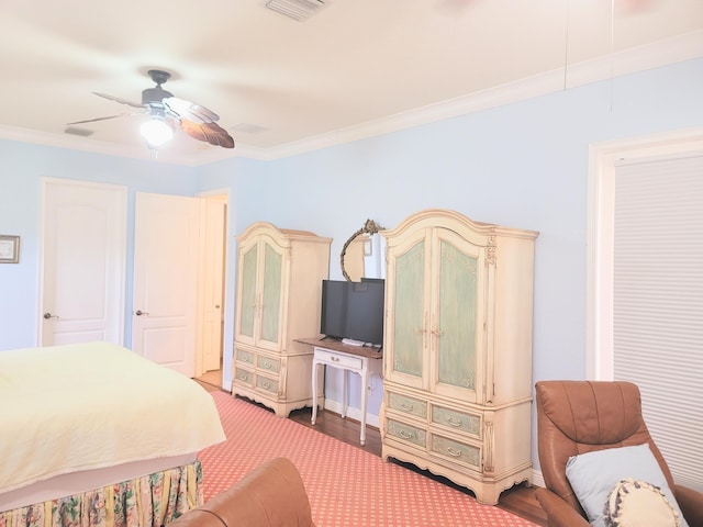 bedroom featuring visible vents, ornamental molding, and a ceiling fan