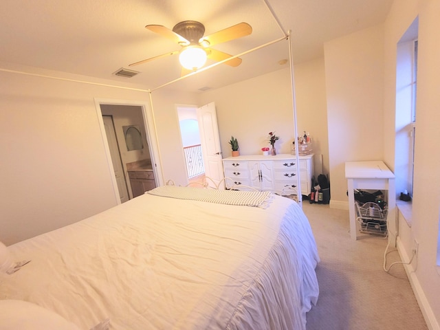 bedroom with light carpet, visible vents, baseboards, and a ceiling fan