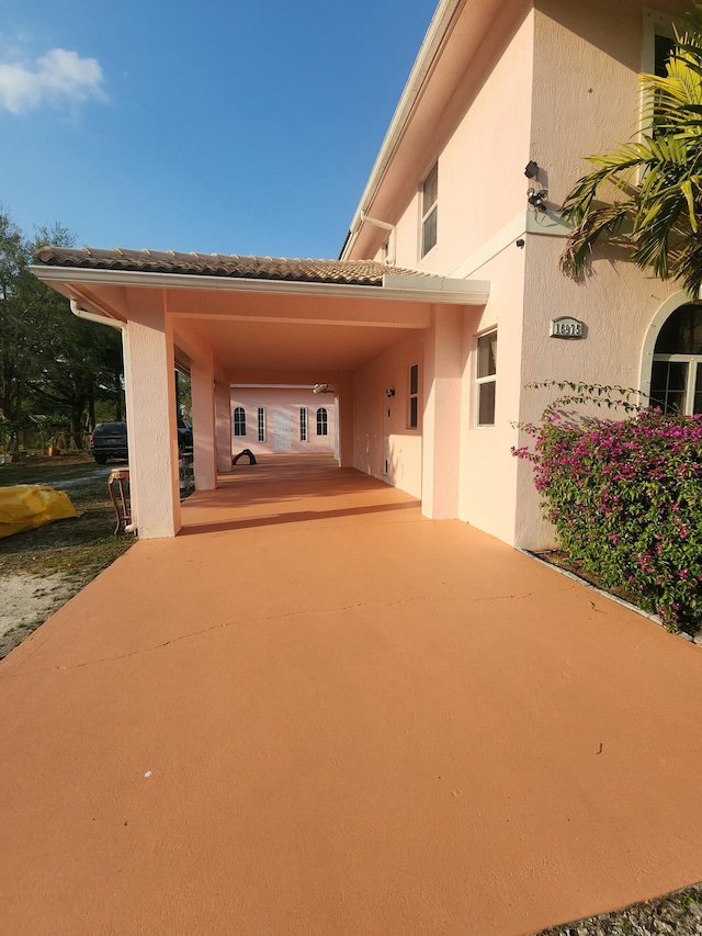 exterior space with an attached carport