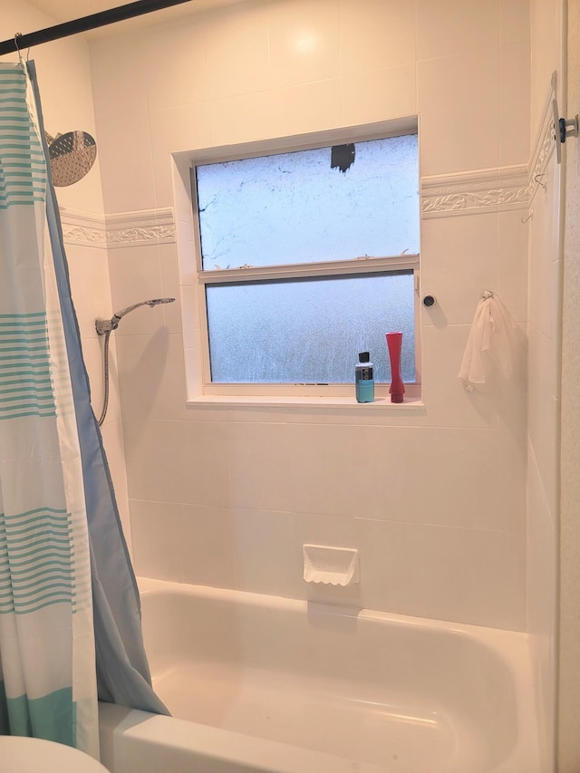 bathroom featuring shower / bath combination with curtain