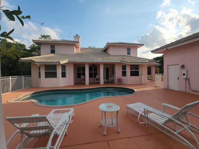 view of pool featuring a patio area, a fenced in pool, and fence