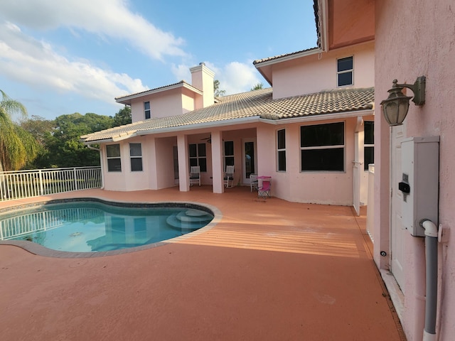 view of swimming pool with a fenced in pool, a ceiling fan, a patio, and fence