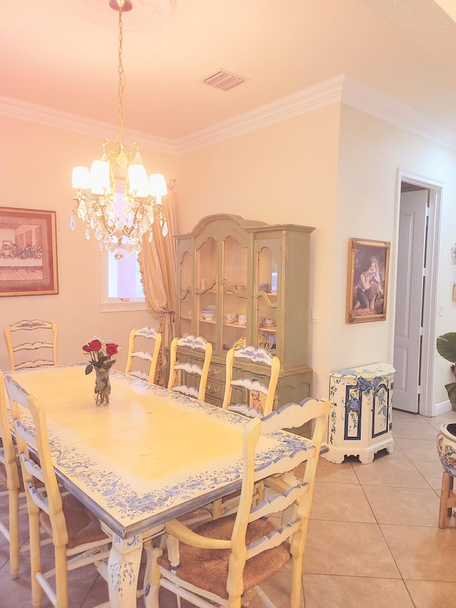 dining area featuring light tile patterned flooring, visible vents, a chandelier, and ornamental molding