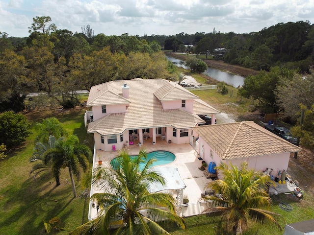 aerial view featuring a wooded view