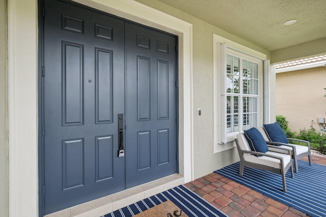 property entrance featuring covered porch