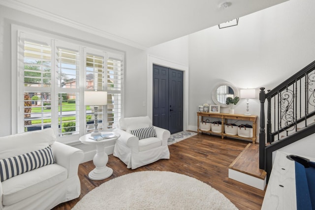 interior space with stairway, wood finished floors, and ornamental molding