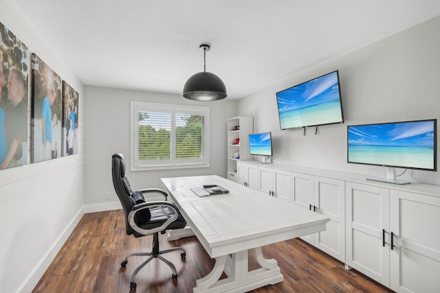 office area with dark wood-style floors and baseboards