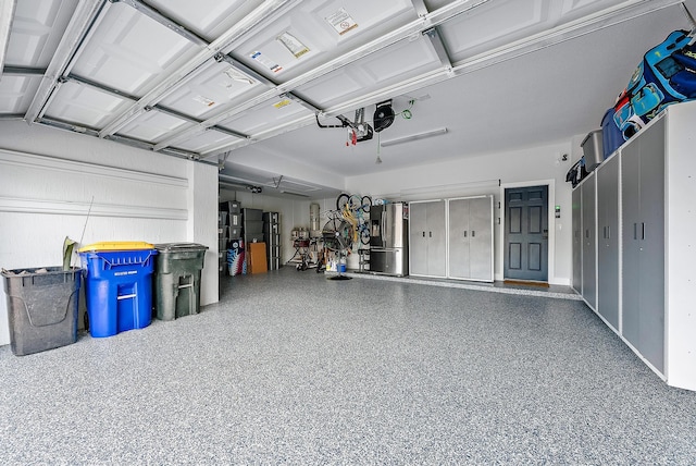 garage with stainless steel fridge