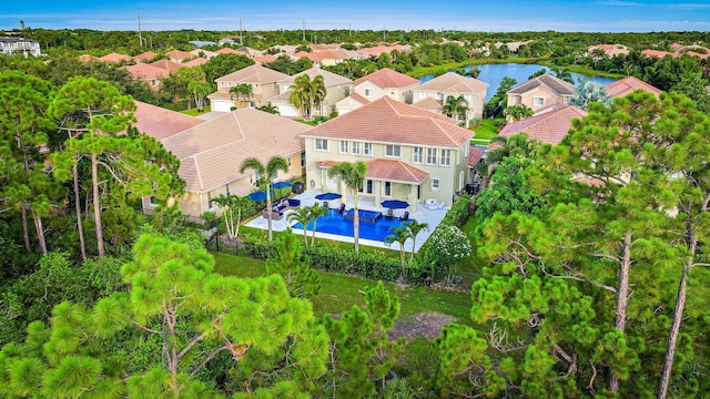 birds eye view of property featuring a residential view and a water view