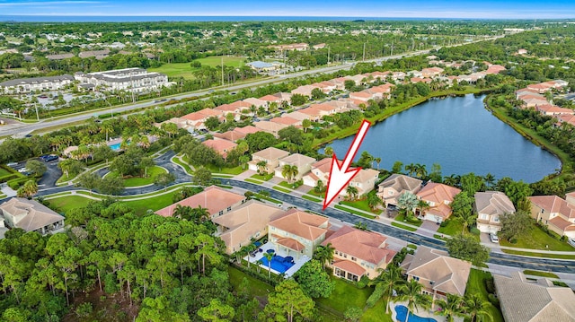 birds eye view of property featuring a residential view and a water view