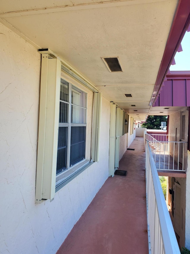 view of patio with visible vents and a balcony