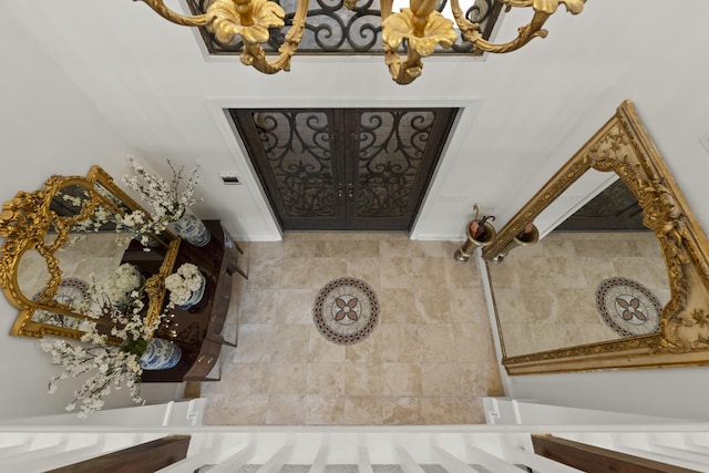 foyer entrance featuring an inviting chandelier