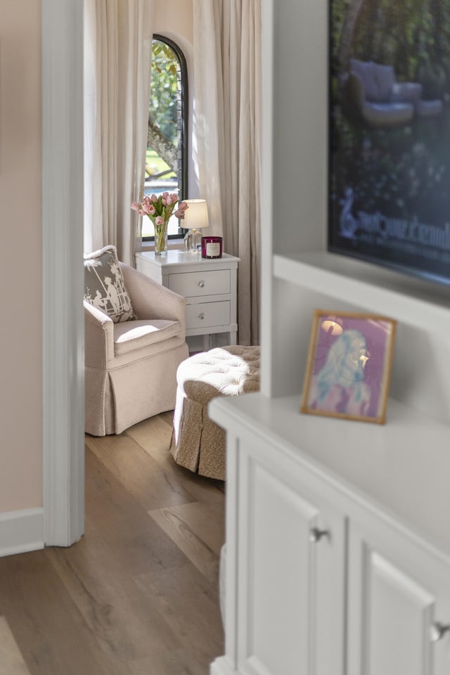 sitting room featuring wood finished floors